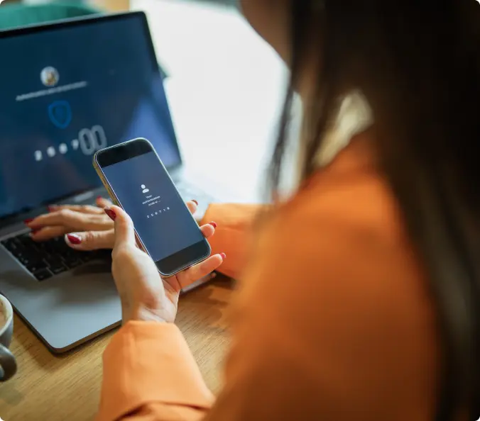 Reviewing managed security reporting on a laptop and phone